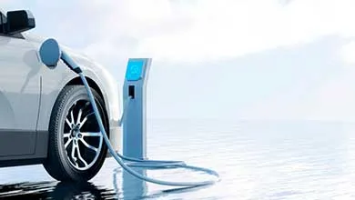 Electric vehicle connected to a charging station with a visible charging cable against a clean, minimal background.